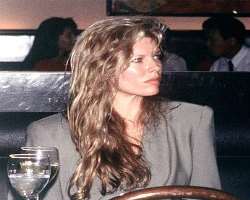 Kim Basinger consuming alcohol